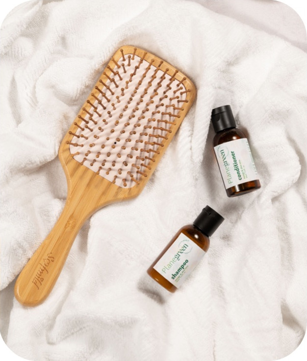 Sustainable airline hairbrush and essential oils.